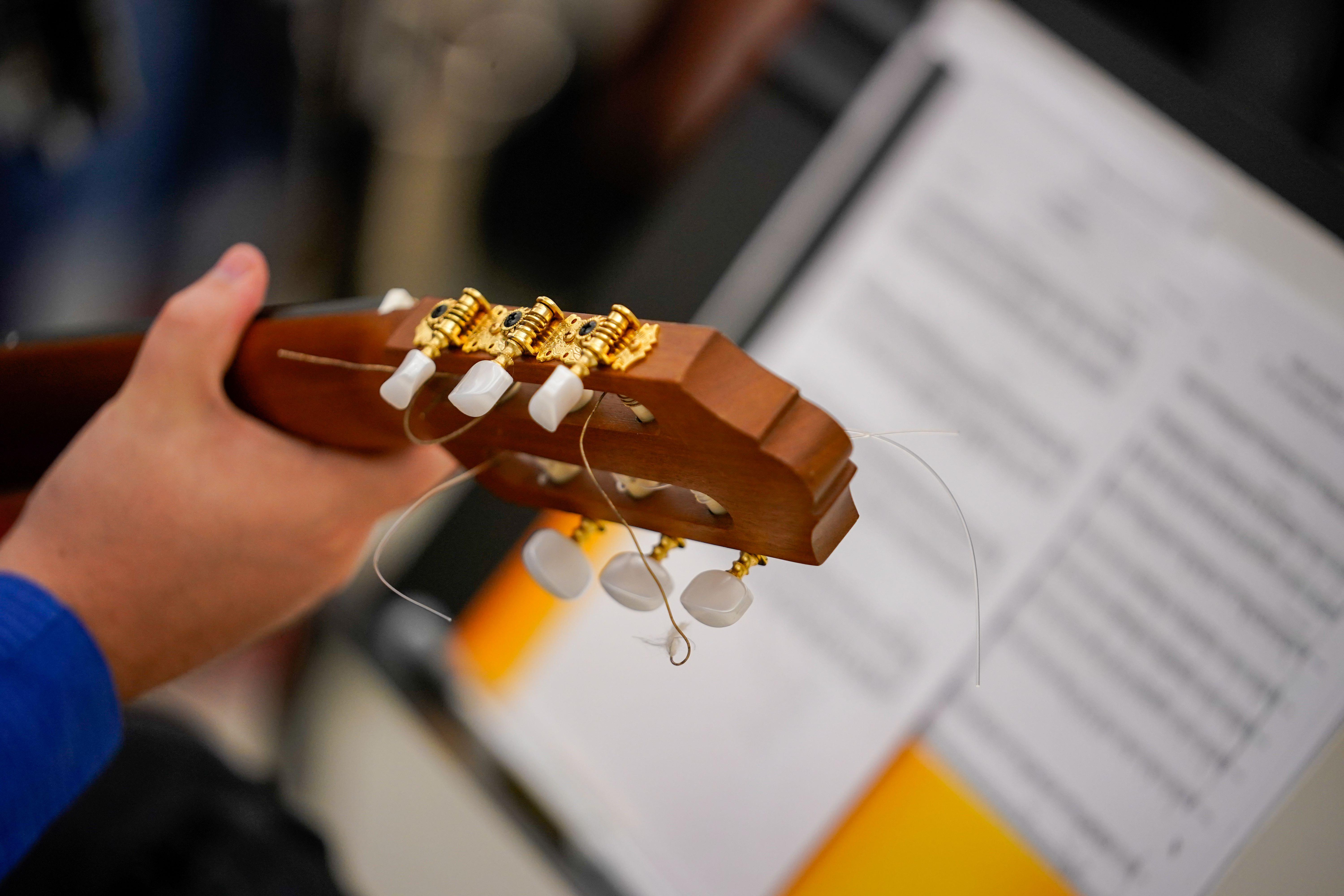 Student Playing Guitar