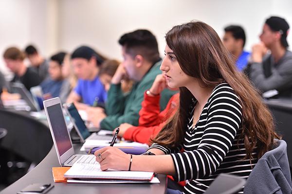 Student takes notes in class