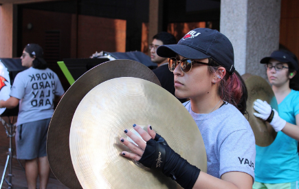 Ambar Valtierra playing cymbals