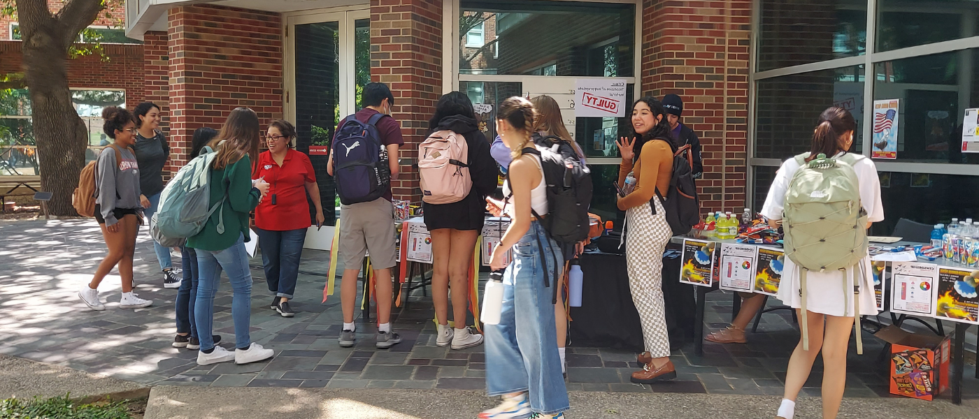 Students at a table discussing banned books