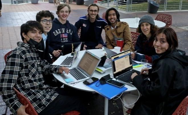 UIW students sitting on the patio of the SEC