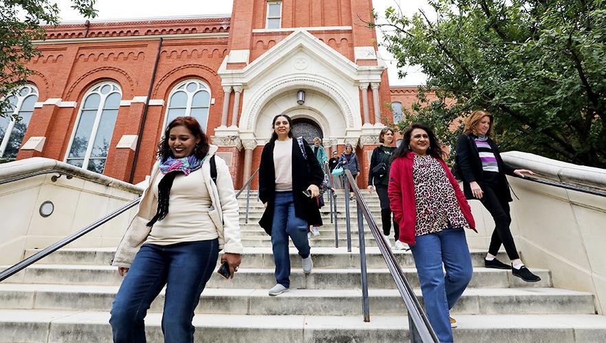 Nurses walking up chapel stairs