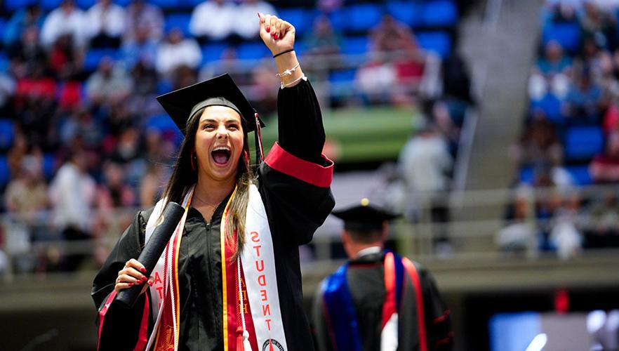 Graduate smiling on stage